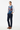 Geometric tribal vest layered over white shirt for smart-casual look