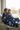 Kids sharing blanket on window seat