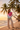 Latina model — beige linen pants, palm beach