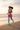 Latina model — sports bra, jogging shoreline