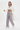 Look 8 – White sports bra, open trench & platform sneakers