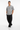 Male model in black cargo pants and white sneakers