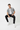 Male model in black joggers and high-top sneakers