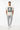 Natural cream tee with light grey tech joggers and minimalist sneakers
