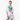 Sports bra styled as beachwear with white shorts and cover-up