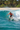 Surfing tropical beach wave