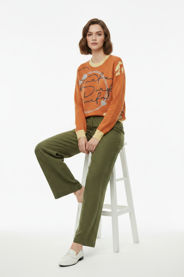 Sweater with Olive Linen Trousers Seated