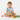 Toddler sitting playing