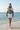 Water's Edge — White Mini Skirt & Flat Sandals