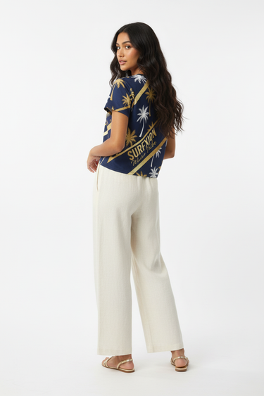 3/4 Back - South Asian model, cream linen pants