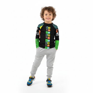 6-8 year old boy in Play Robo rash guard with joggers on white background