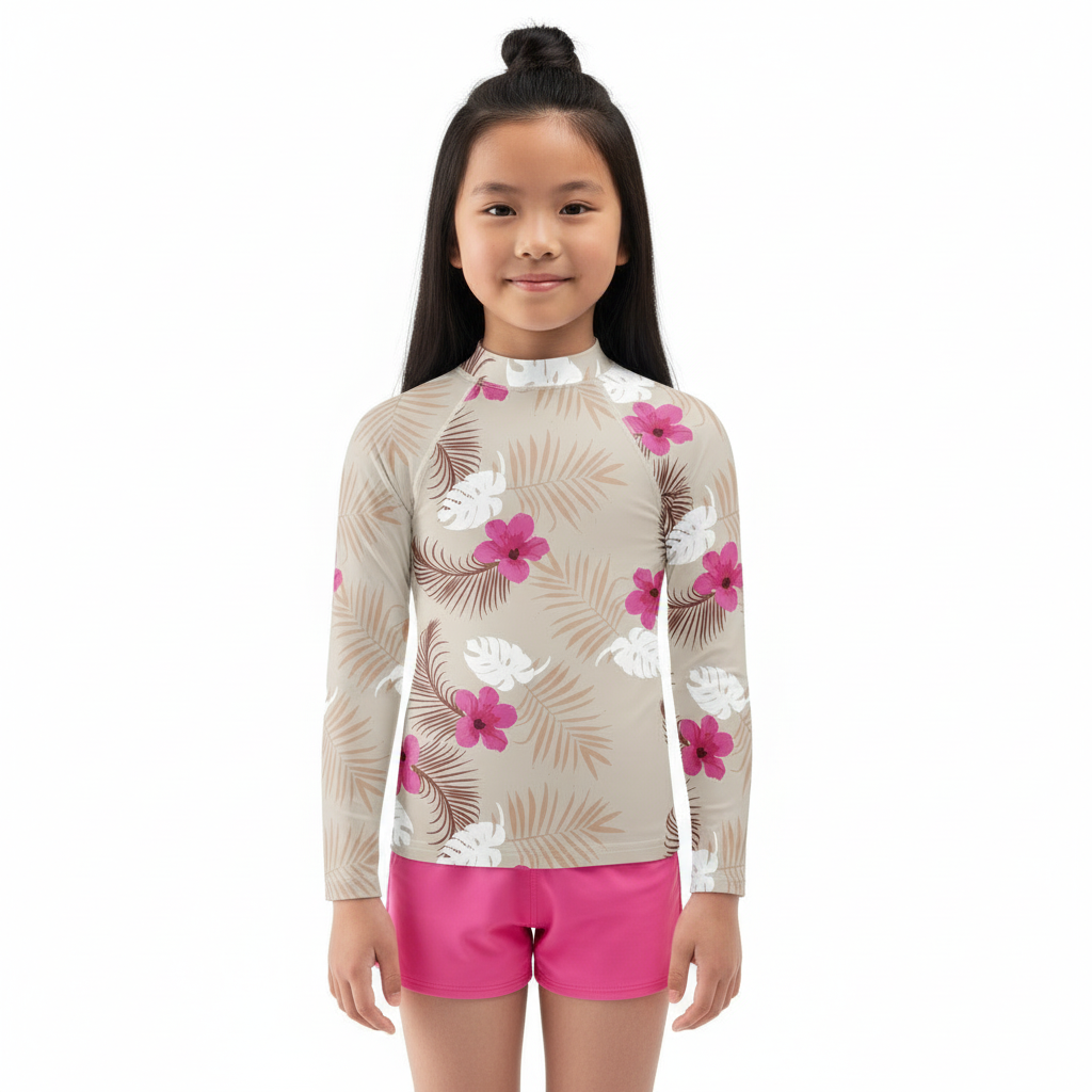 Asian girl in Sandcastle Dreams rash guard on white background