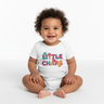 Baby girl white monster onesie sitting