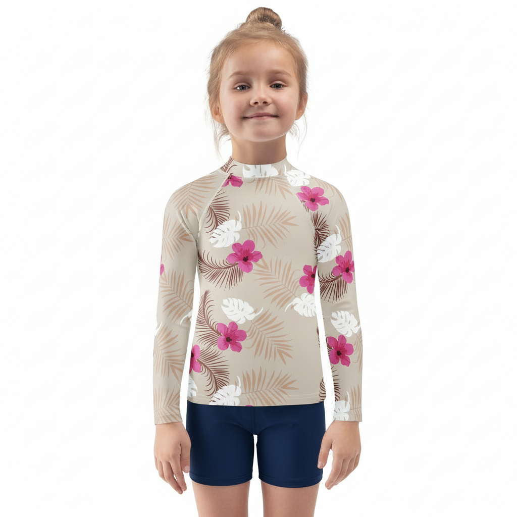 Blonde girl in Sandcastle Dreams rash guard on white background