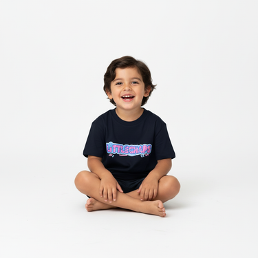 Boy sitting navy tee
