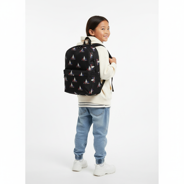 Child back view showing backpack - white background