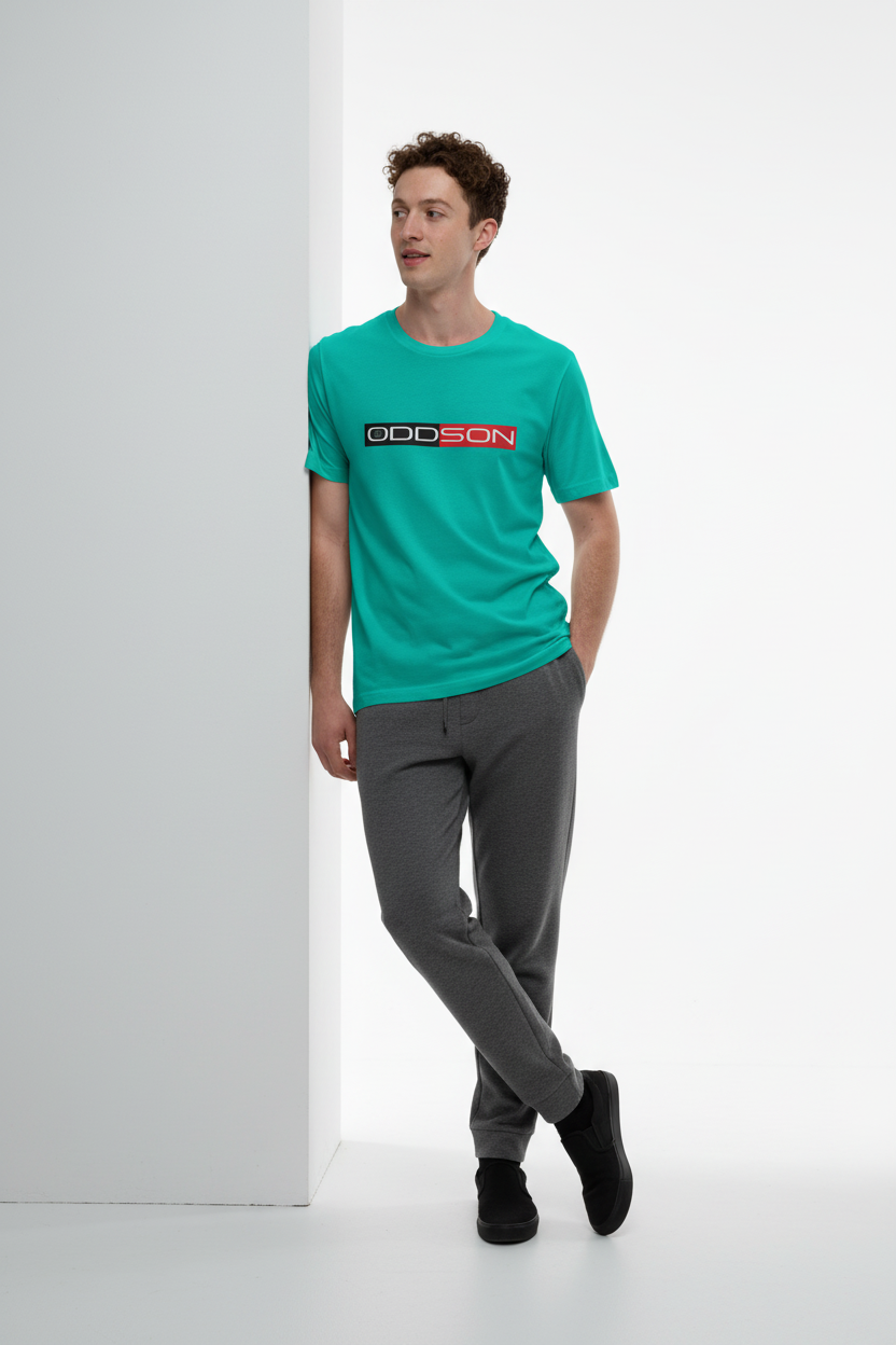 Deep teal t-shirt with charcoal sweatpants and slip-ons