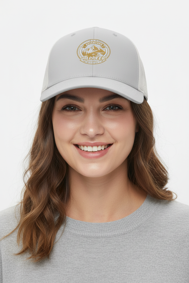 Female model close-up wearing silver trucker hat