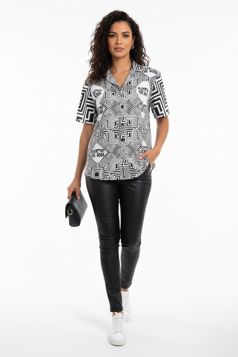 Female model in black leather pants and white sneakers