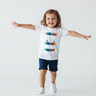 Girl age 3 arms outstretched playful