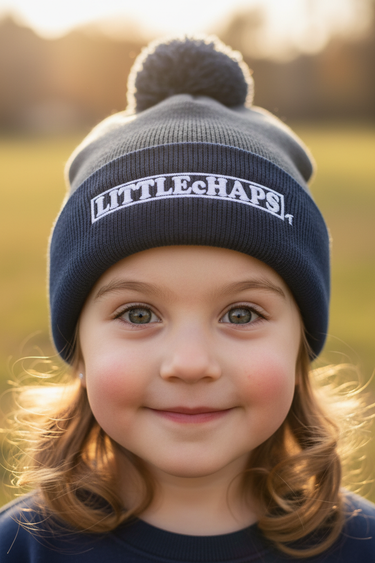 Girl age 4 wearing grey and navy beanie