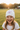 Girl age 7 wearing castle beanie
