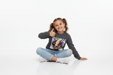 Girl in dark heather sweatshirt sitting