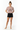 Hazy pink crop top with hands behind back