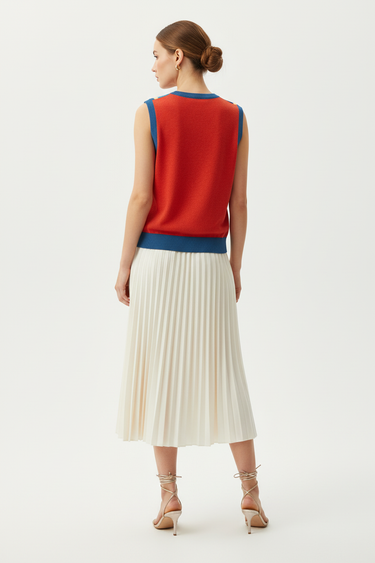 Back view of vest with pleated midi skirt