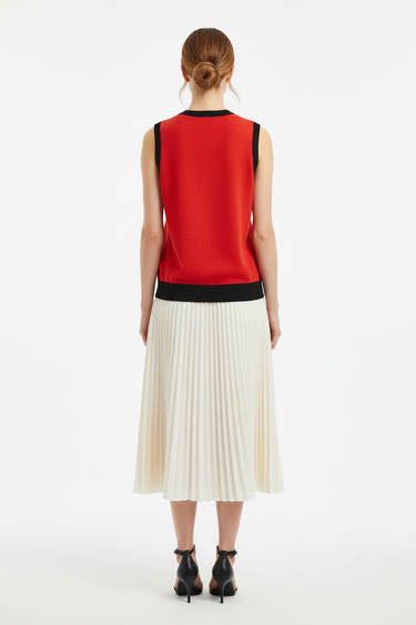 Back view of vest with pleated midi skirt