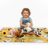 Child playing with stuffed animals on farm blanket white background