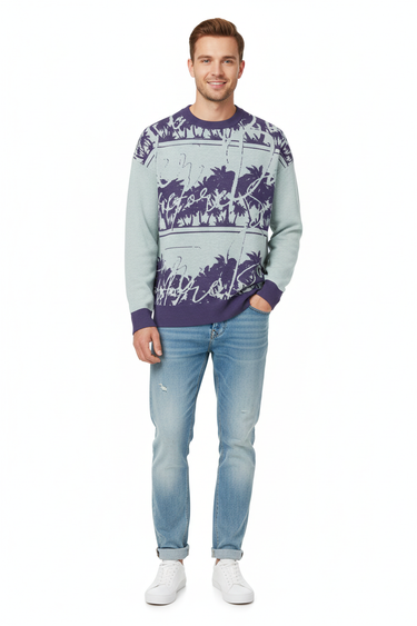 Tropical palm sweater styled casually with light wash denim and white sneakers