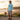 Latino male model in aqua hoodie coastal setting