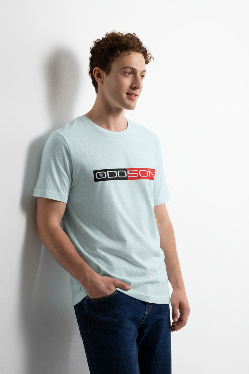 Light blue t-shirt leaning against wall