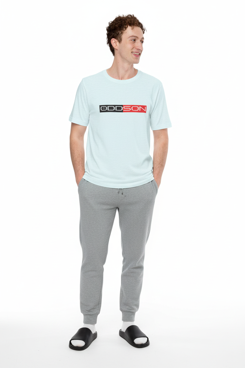 Light blue t-shirt with grey joggers and slides