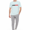 Light blue t-shirt with light grey tech joggers and minimalist sneakers