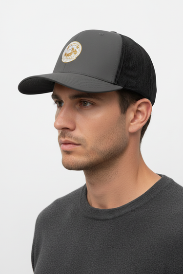 Male model close-up side profile wearing charcoal trucker hat
