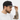 Man wearing black and grey snapback, side profile