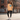 Middle Eastern female model in peach hoodie urban setting