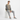 Model in sweater with gray joggers and slip-ons