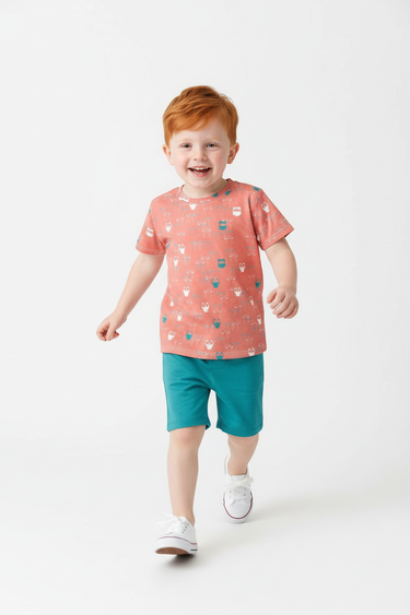 Red-haired child in teal shorts