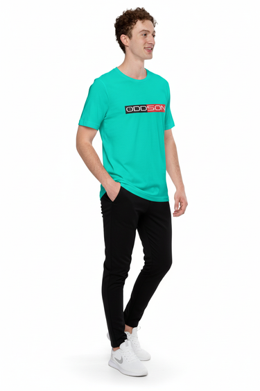 Teal t-shirt with black joggers and white sneakers