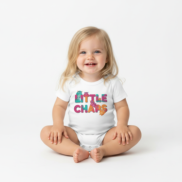Toddler girl white monster onesie sitting