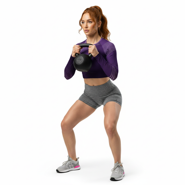White athlete with red hair with kettlebell