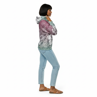 Woman with short hair in tropical floral zip hoodie with jeans